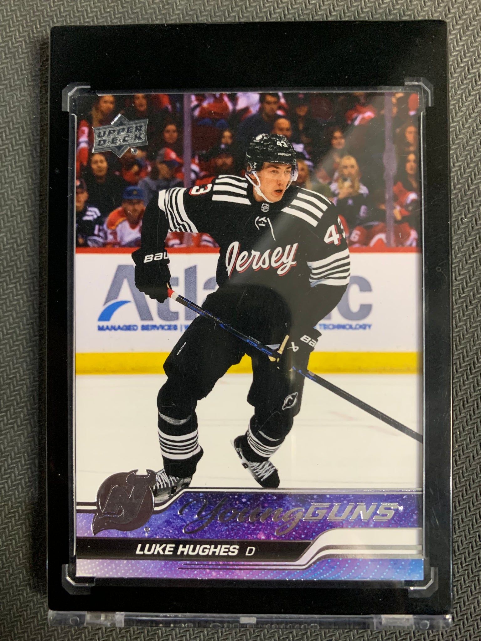 2023-24 UPPER DECK SERIES 1 HOCKEY #248 NEW JERSEY DEVILS - LUKE HUGHES YOUNG GUNS ROOKIE