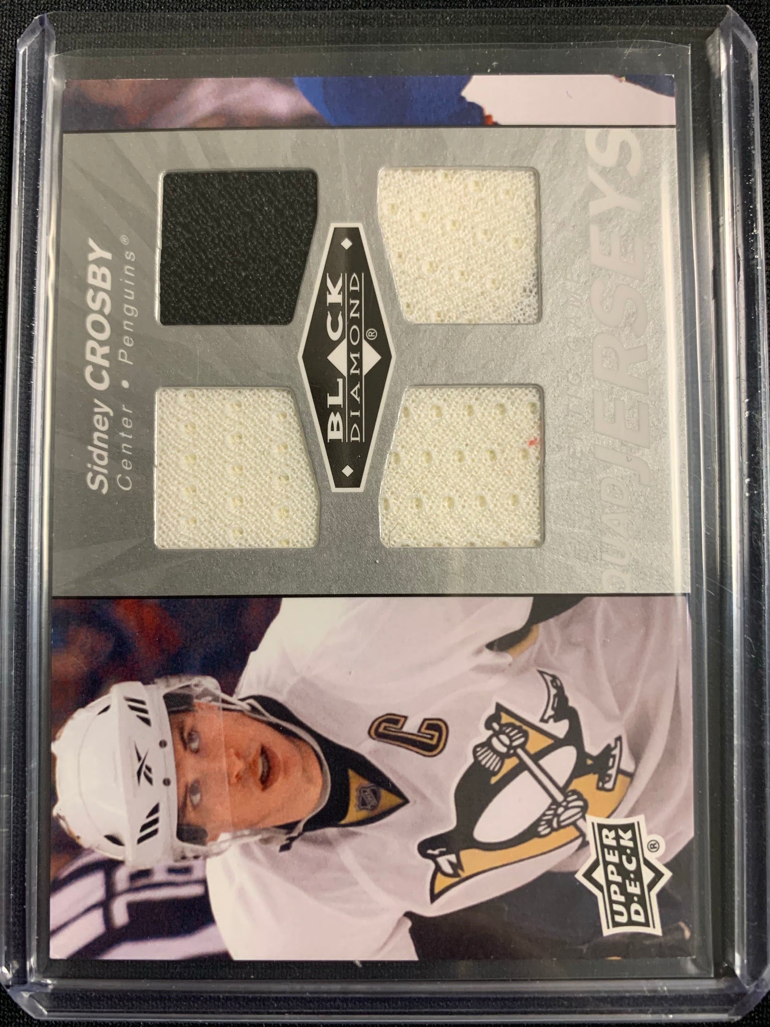 2010-11 UPPER DECK BLACK DIAMOND HOCKEY #QJ-SC PITTSBURGH PENGUINS - SIDNEY CROSBY QUAD JERSEYS GAME USED