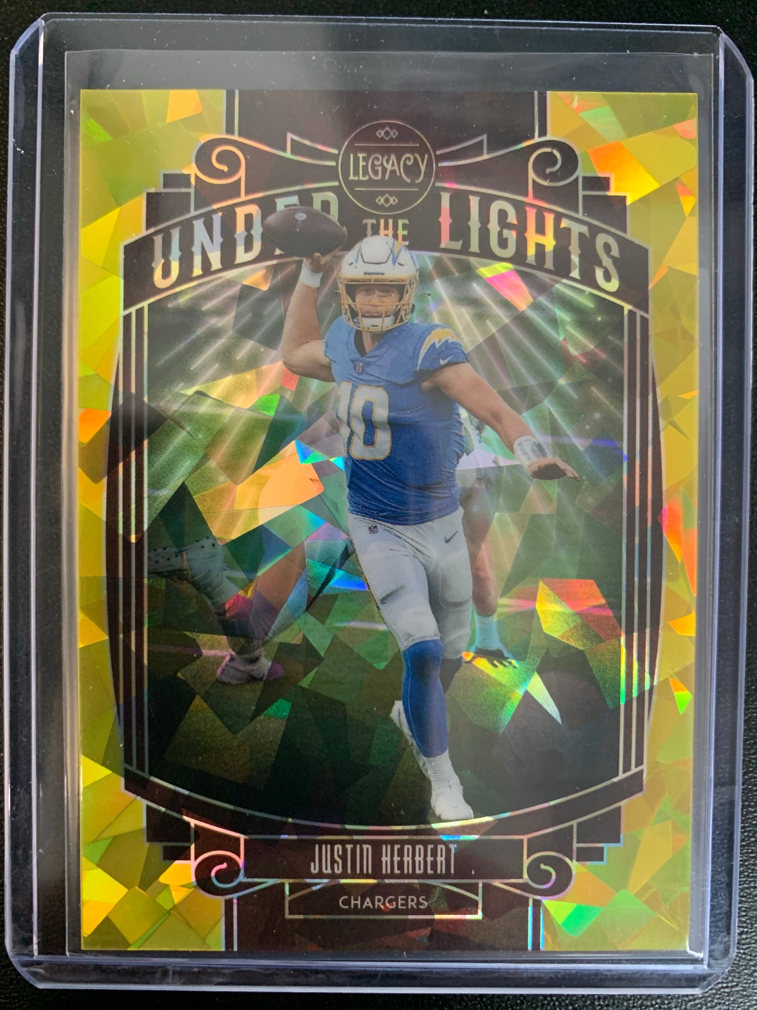 2021 PANINI LEGACY FOOTBALL #UL-JH LOS ANGELES CHARGERS - JUSTIN HERBERT UNDER THE LIGHTS GOLD CRACKED ICE PARALLEL SERIAL NUMBERED 06/25