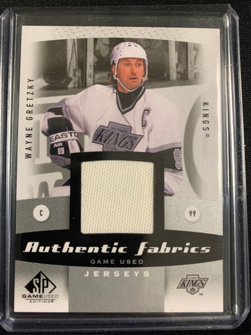 2010-2011 UPPER DECK SP GAME USED HOCKEY #AF-WG LOS ANGELES KINGS - WAYNE GRETZKY AUTHENTIC FABRICS GAME USED JERSEYS